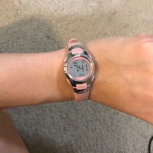 Light pink gently used digital watch